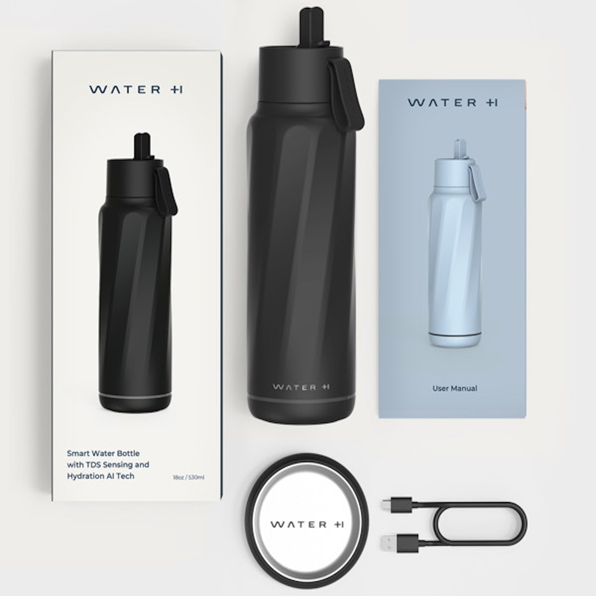 Schwarze intelligente Trinkflasche, Verpackung, Handbuch, Ladestation und Kabel auf weißer Oberfläche.