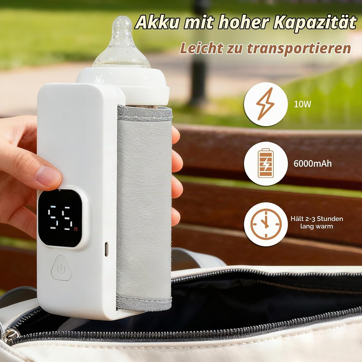 Eine Hand hält einen tragbaren Flaschenwärmer mit digitaler Anzeige, der auf einer Tasche platziert wird.
