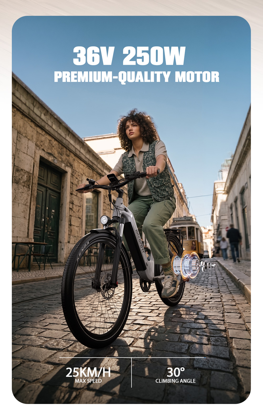 Una donna guida una bici elettrica grigia su una strada acciottolata.