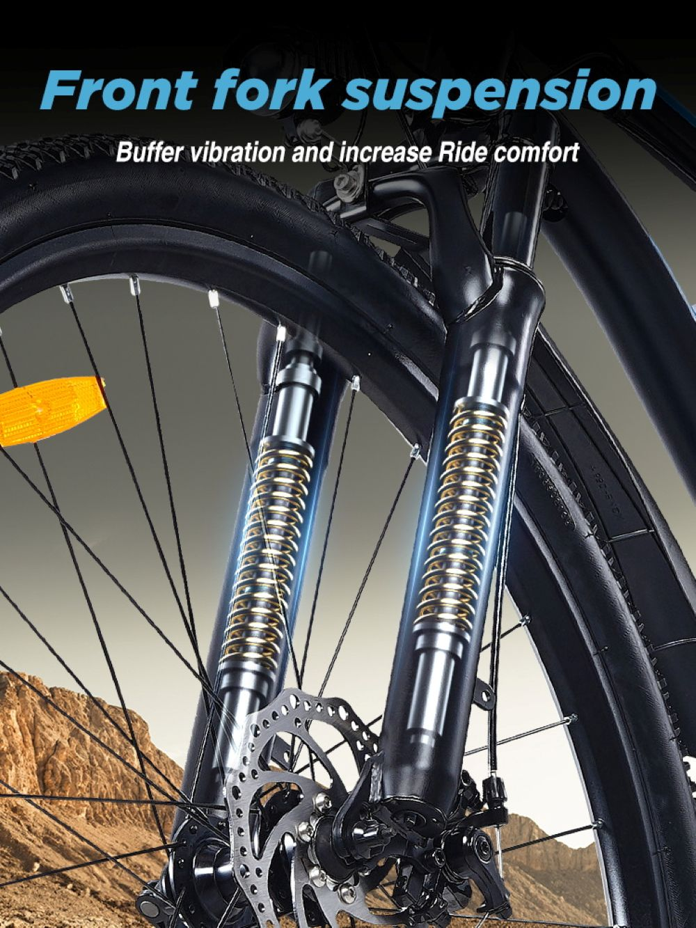 Primo piano della sospensione della forcella anteriore di una bicicletta con molle dorate.