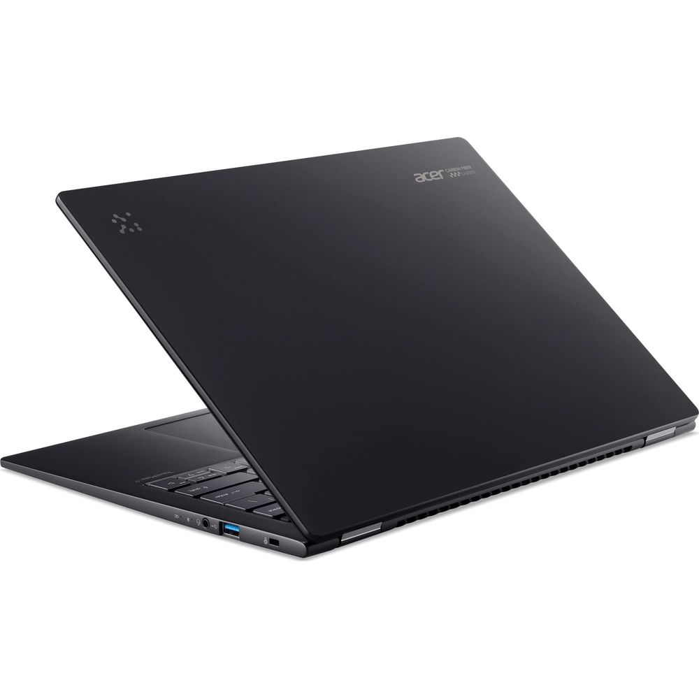 Un laptop Acer nero chiuso si trova su una superficie bianca con porte visibili.