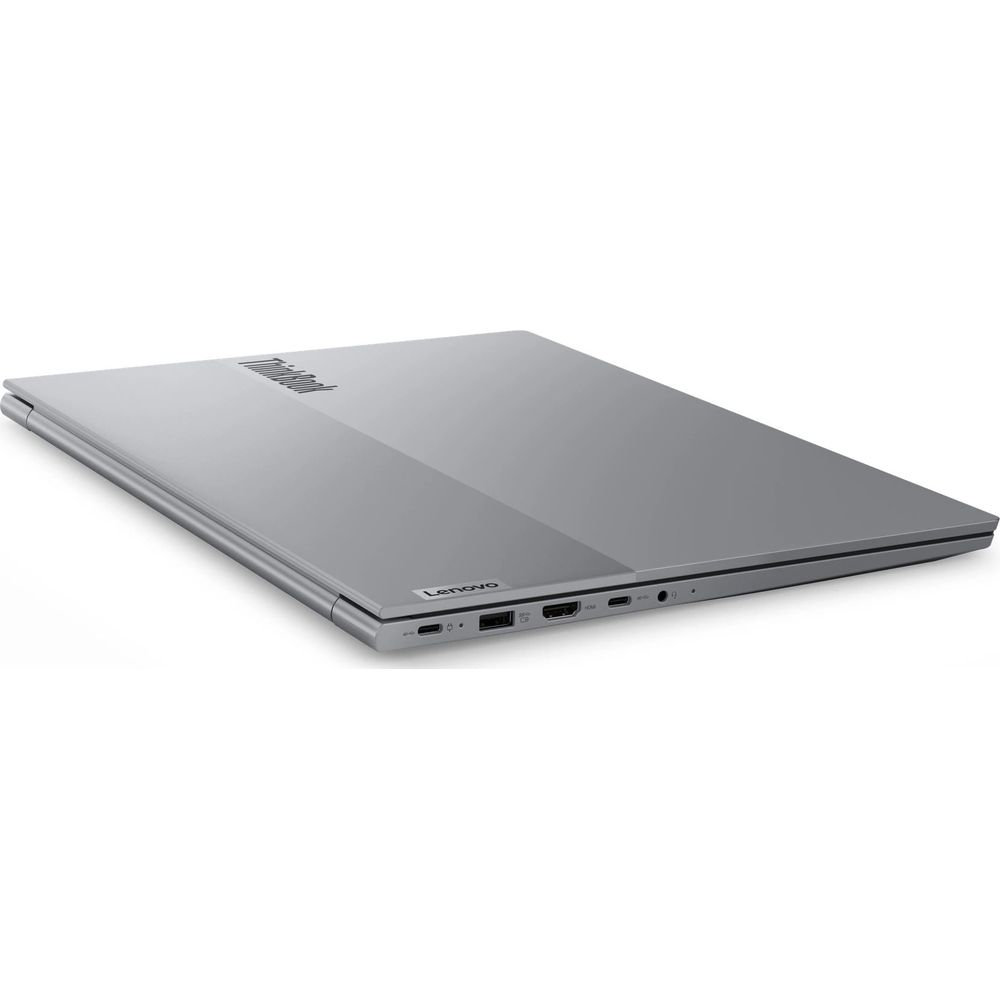 Un ordinateur portable Lenovo ThinkBook argenté fermé sur fond blanc avec des ports visibles sur le côté.