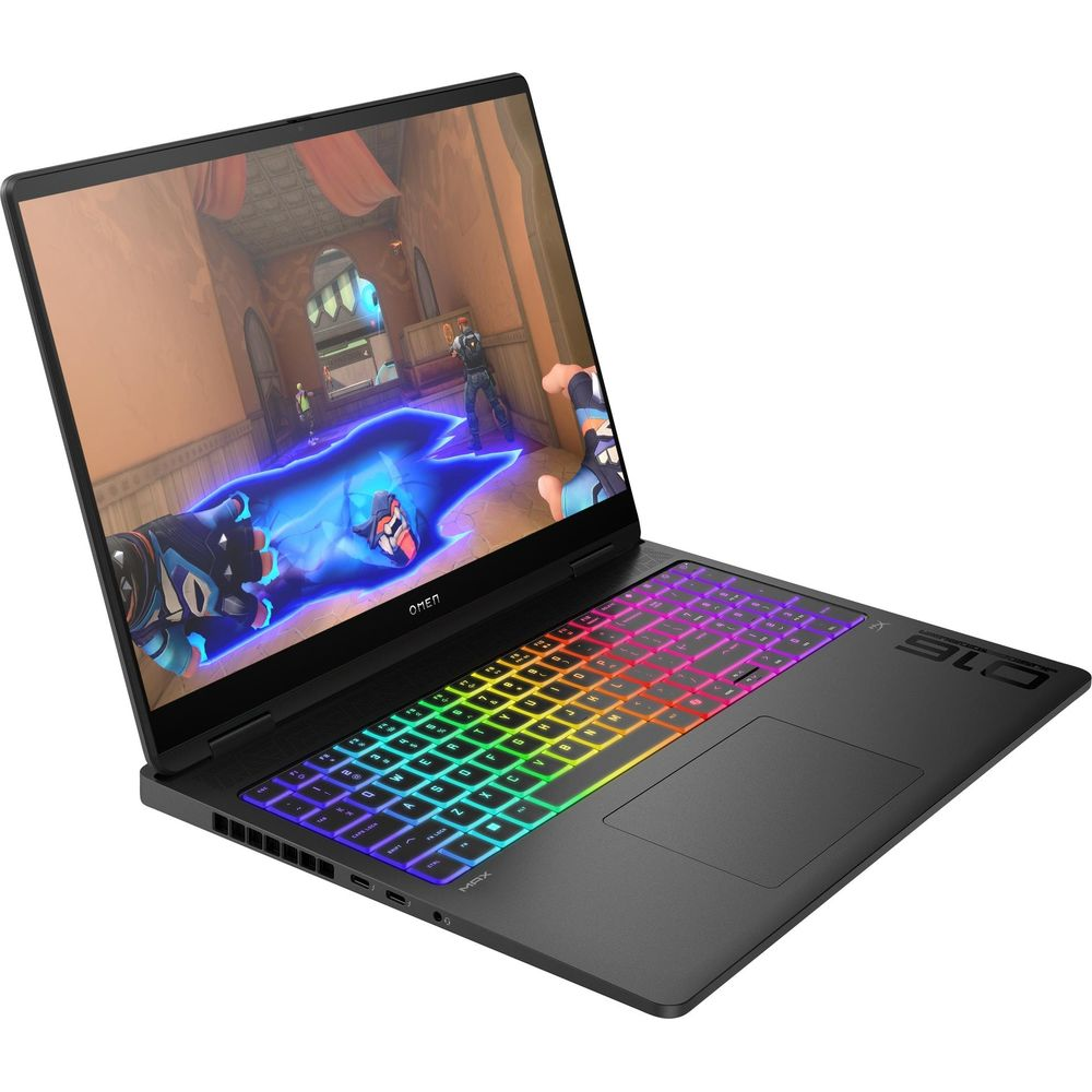 Un laptop da gioco nero con tasti retroilluminati colorati mostra la scena di un videogioco sullo schermo.