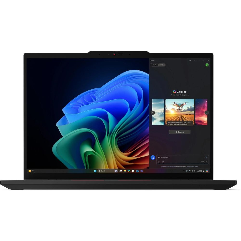 Un computer portatile nero mostra il desktop di Windows con arte astratta blu e la barra laterale di Copilot.