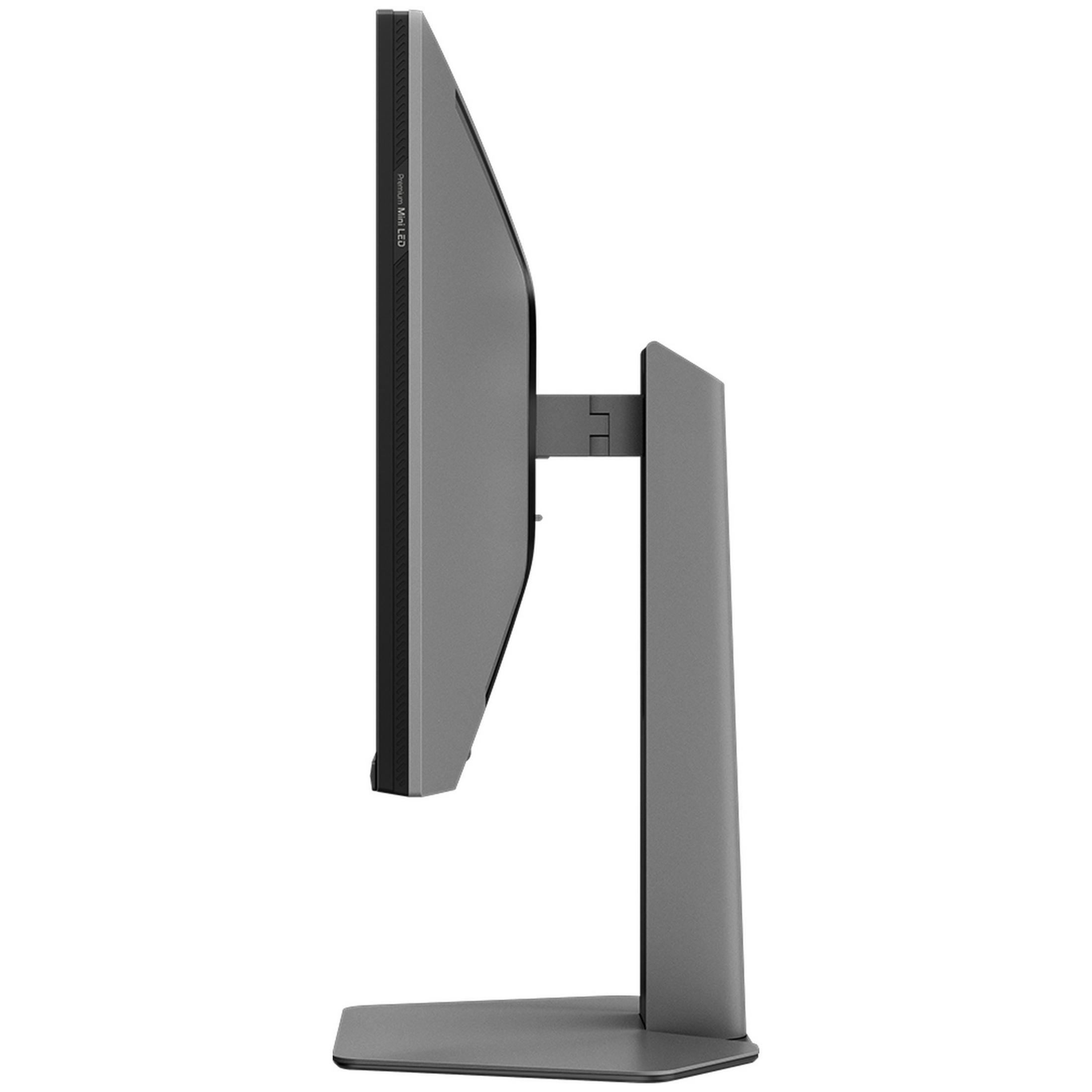 Vista laterale di un monitor per computer grigio su supporto con sfondo bianco.