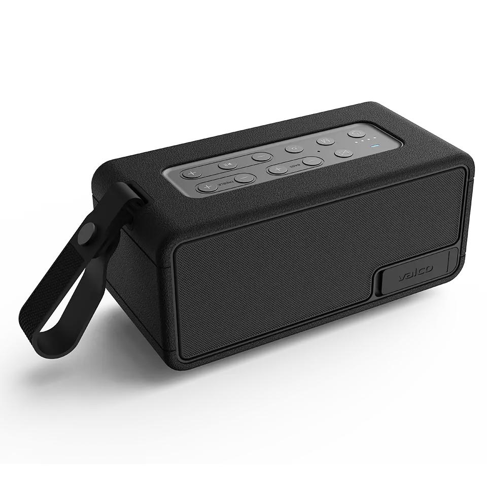 Ein schwarzer Valco Bluetooth-Lautsprecher mit Tragegurt und Tastenfeld auf einer beleuchteten Oberfläche.