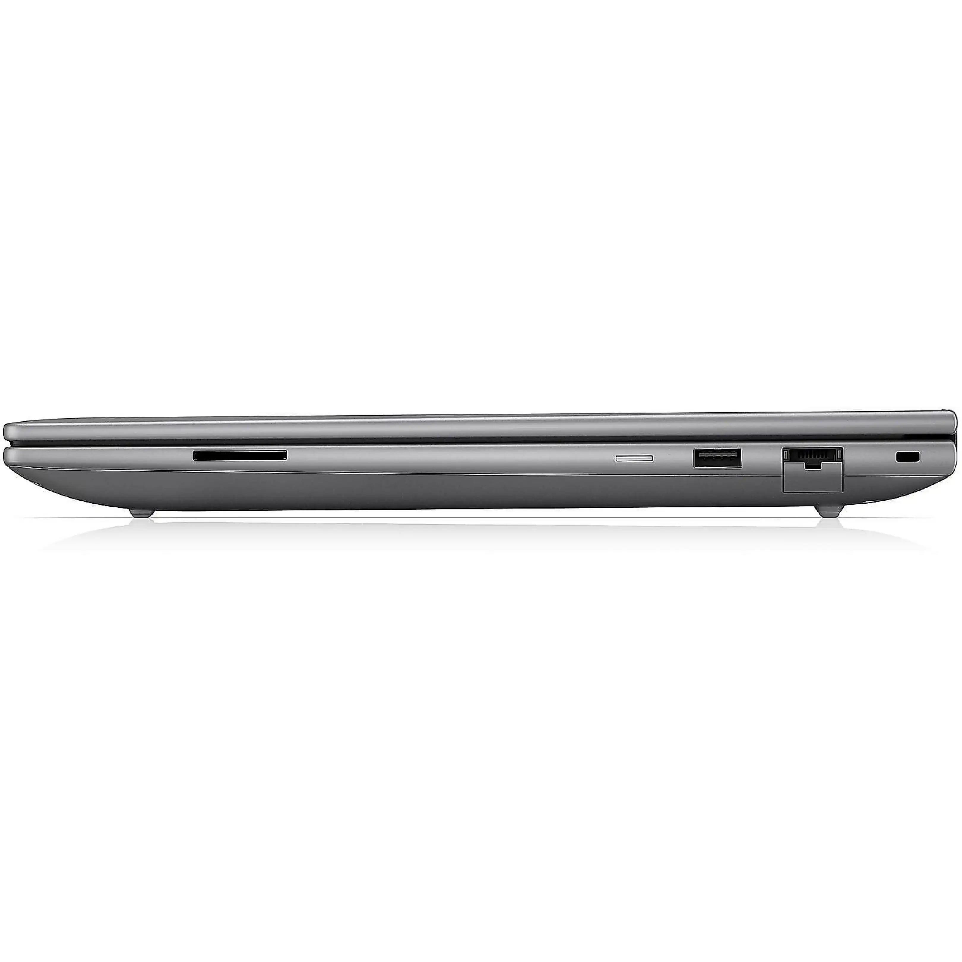 Vista laterale di un laptop grigio chiuso con varie porte su una superficie nera.