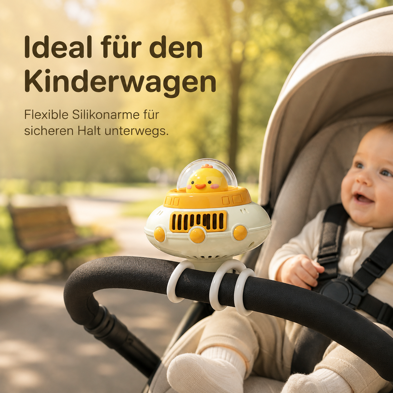 Ein Enten-Raumschiff-Ventilator am Kinderwagen befestigt, mit einem Baby im Hintergrund im Park.