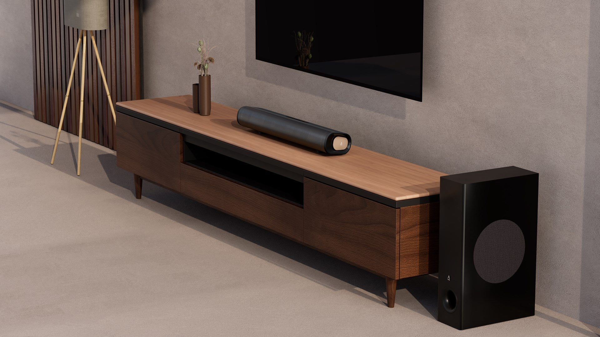 Une barre de son sur un meuble en bois sous une télé, avec un caisson de basse noir à côté.