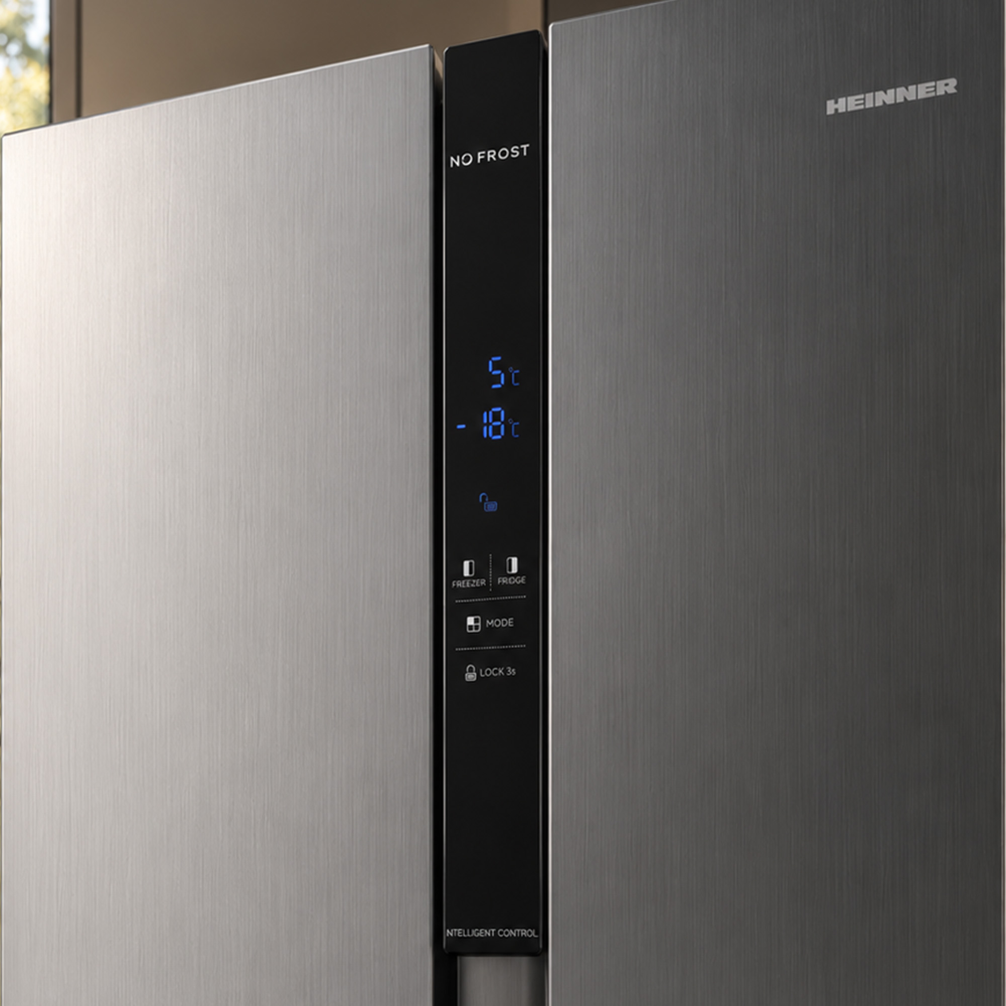 Silver Heinner refrigerator featuring No Frost technology and a central black digital control panel.
