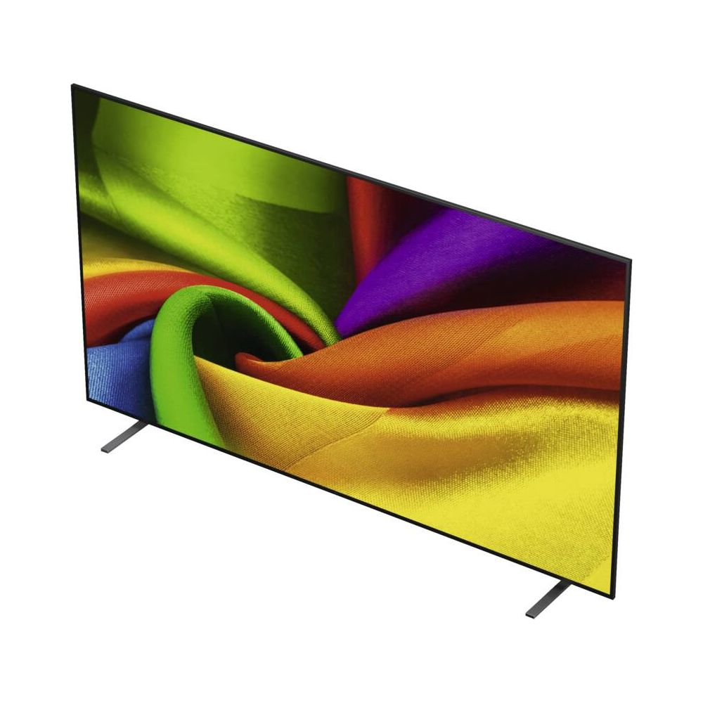 Un téléviseur mince à deux pieds étroits affiche un motif coloré semblable à du tissu en vert, orange et violet.