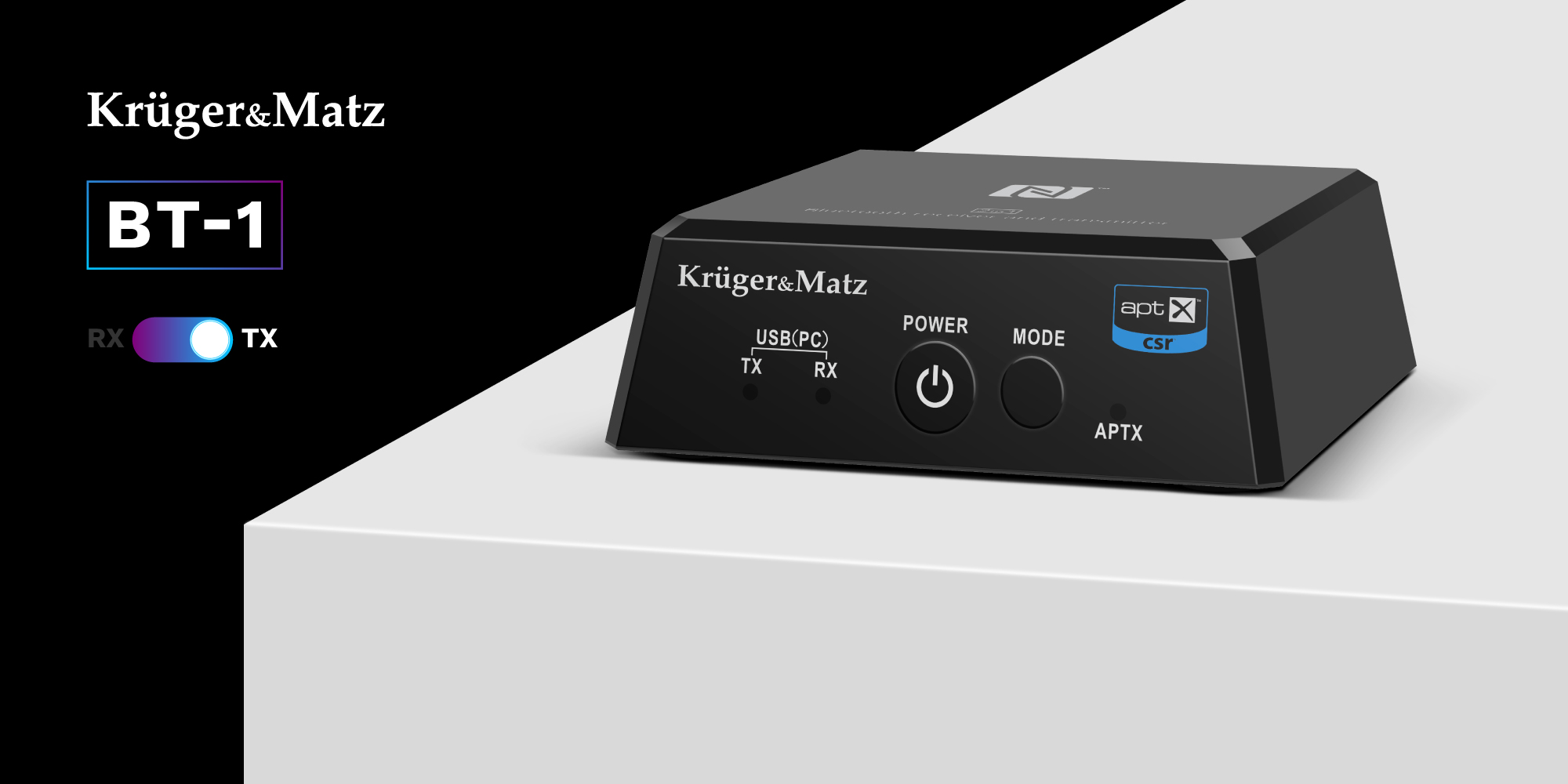 Czarny nadajnik i odbiornik Bluetooth Krüger&Matz BT-1 na białej powierzchni z przyciskami sterującymi.