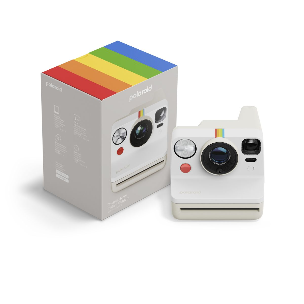 Un appareil photo instantané Polaroid blanc avec des touches colorées posé à côté de sa boîte sur fond blanc.