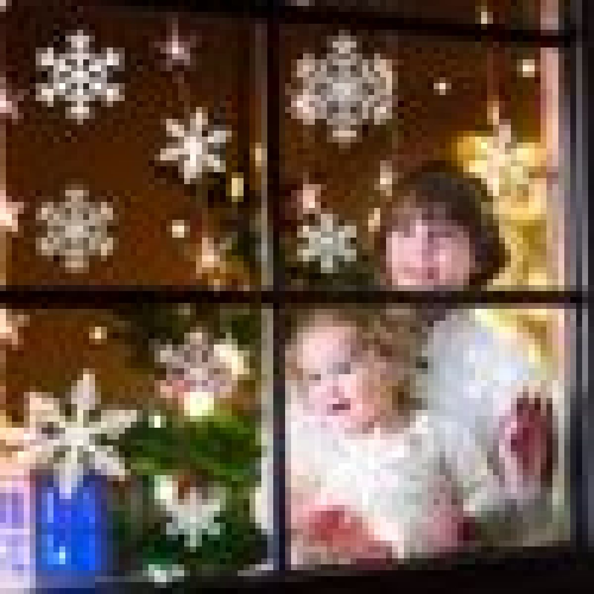 Zwei Personen schauen aus einem Fenster, das mit Schneeflocken und Lichtern dekoriert ist.