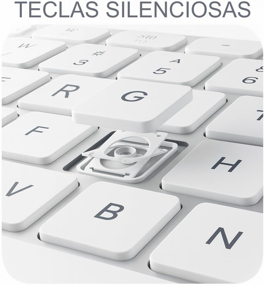 Primer plano de un teclado blanco con la tecla G desmontada, revelando el mecanismo.
