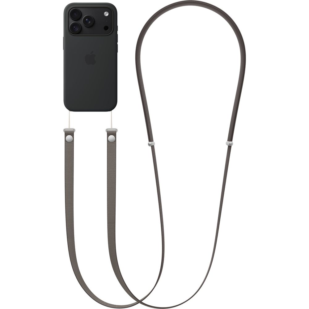 Un teléfono negro en funda negra sujeto a una correa larga y marrón de tela sobre fondo blanco.