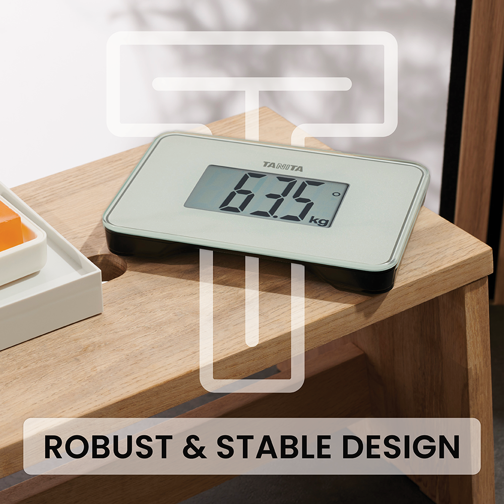 A Tanita digital scale on a wooden bench, featuring a white T-shape graphic and ROBUST & STABLE DESIGN text.