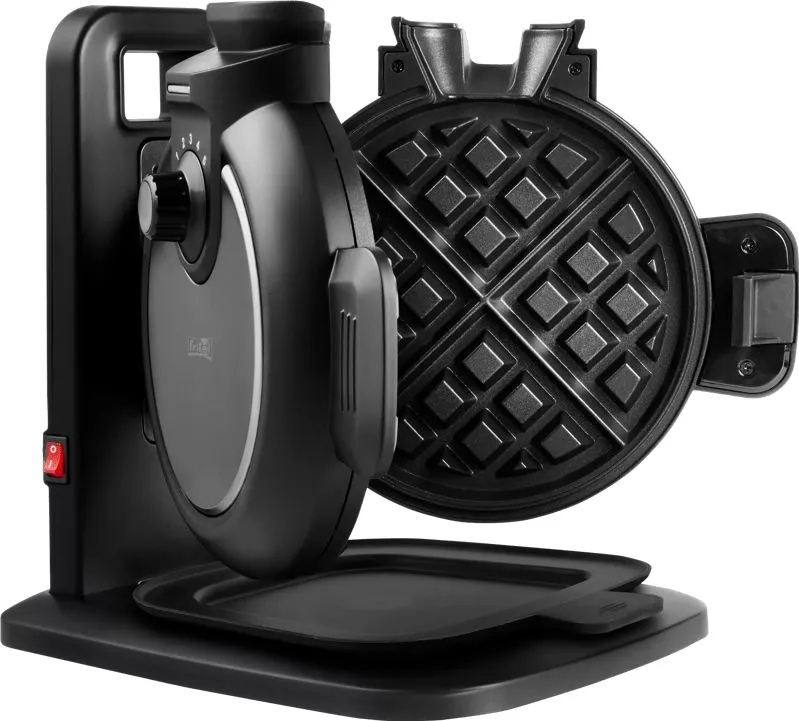 A black vertical waffle maker with non-stick grids open, a control dial, and a crumb tray on a white background.
