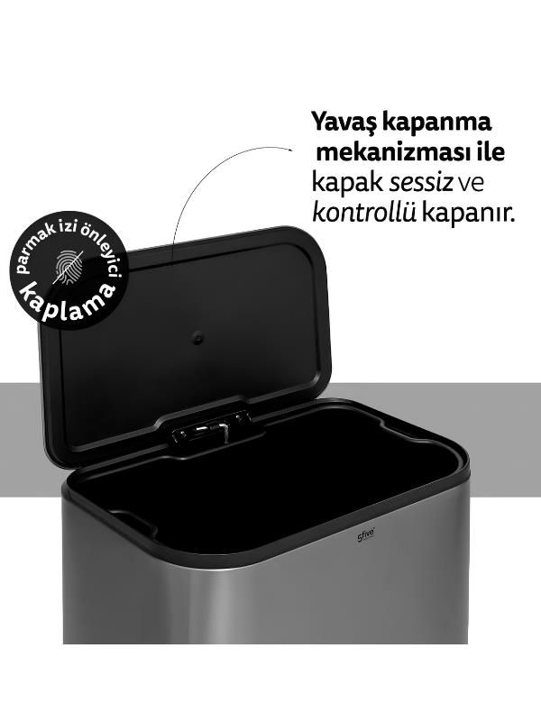 Yavaş kapanma mekanizması ve parmak izi önleyici kaplaması olan açık kapaklı gri çöp kovası.
