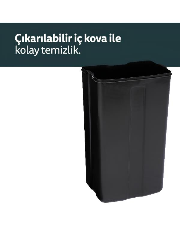 Beyaz arka plan önünde siyah, dikdörtgen çöp kovası.