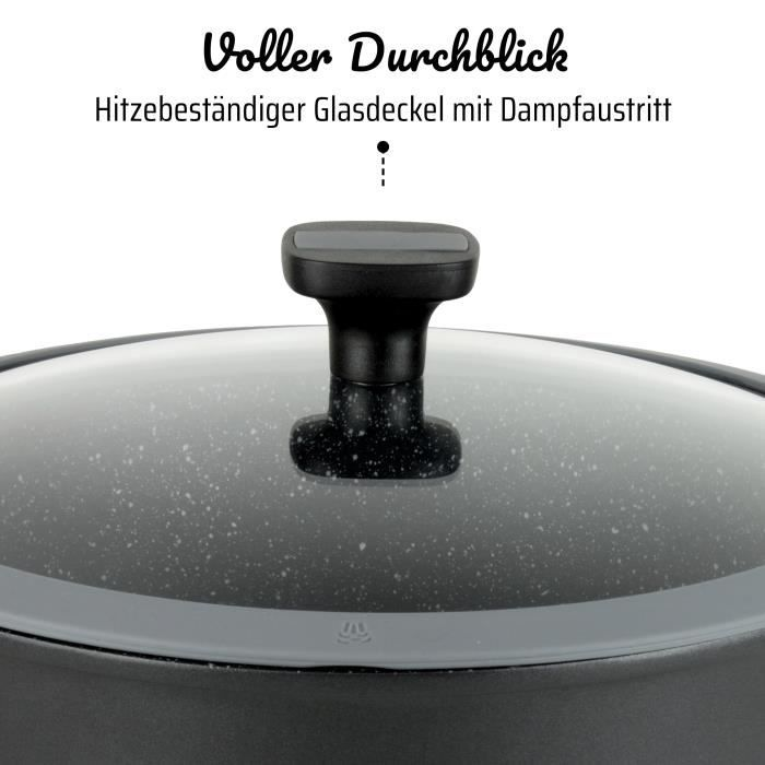 Tapa de vidrio resistente al calor con salida de vapor en una olla con pomo negro y borde gris.