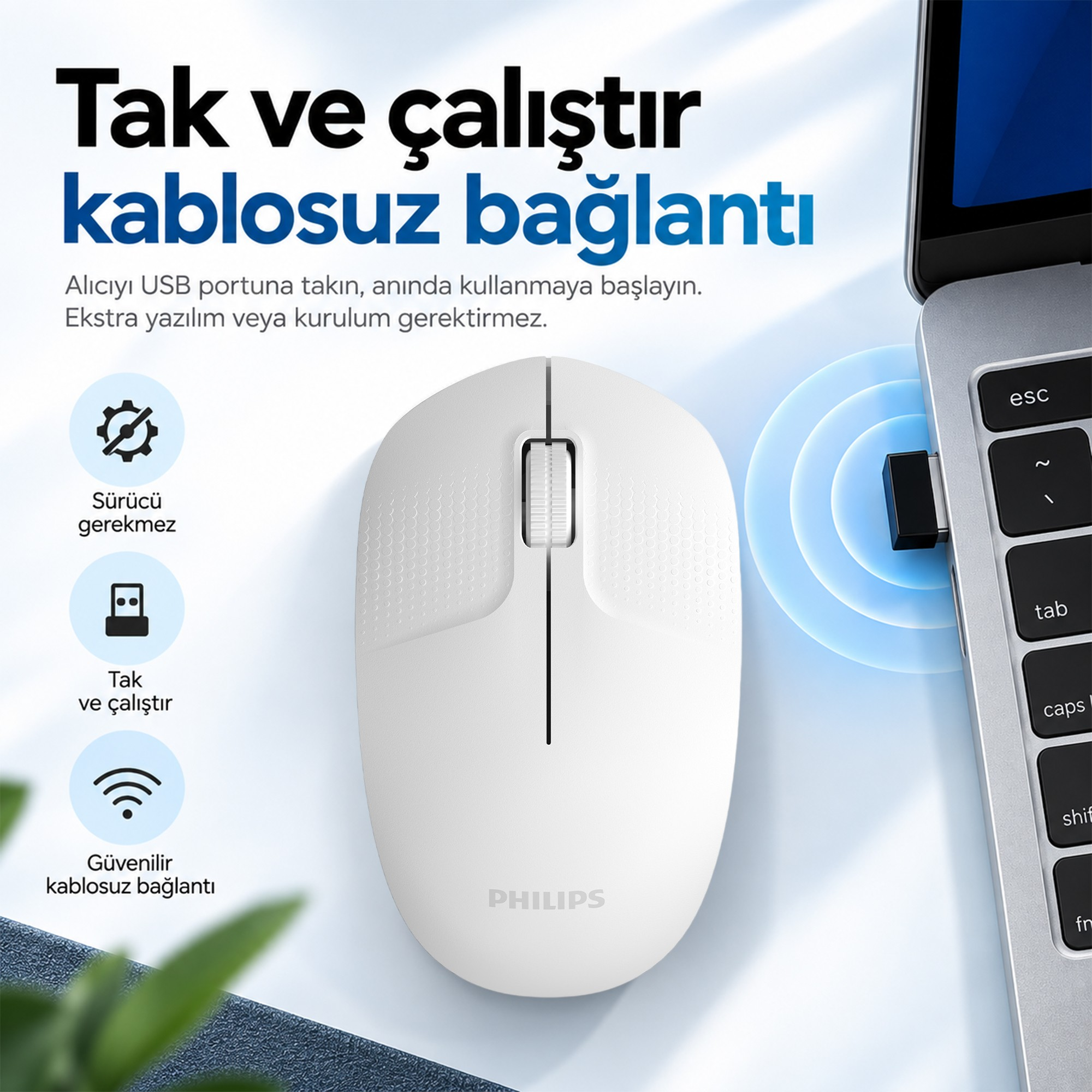 USB alıcı sinyali gösteren bir dizüstü bilgisayarın yanında beyaz bir Philips fare.