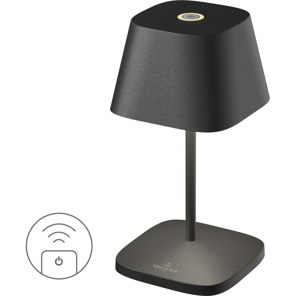 Lampada da tavolo nera senza fili con base e paralume quadrati. Icona wireless in basso a sinistra.