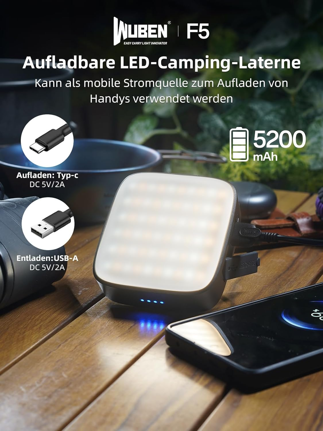 Wuben F5 LED-Camping-Laterne auf Holzfisch, dient auch als Powerbank für Smartphones.