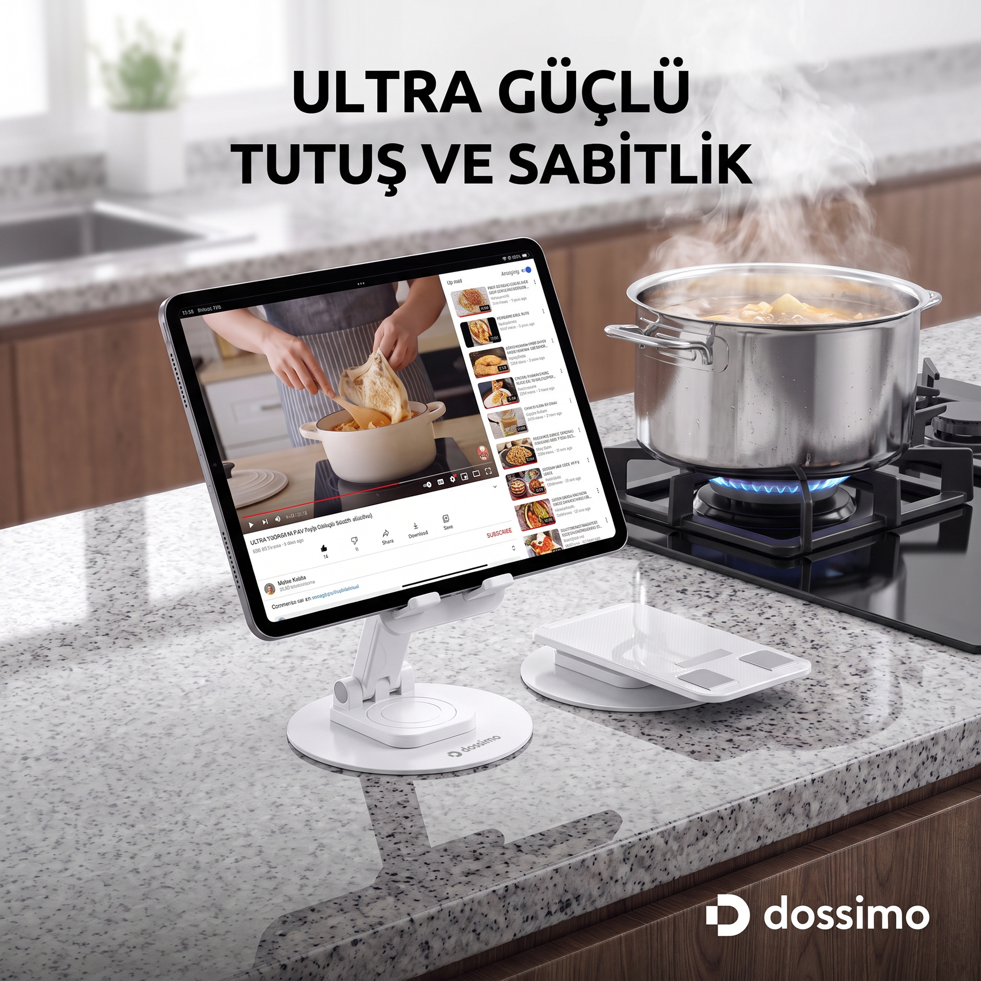 Kaynayan bir tencerenin yanında, mutfak tezgahında stant üzerinde bir tablet.
