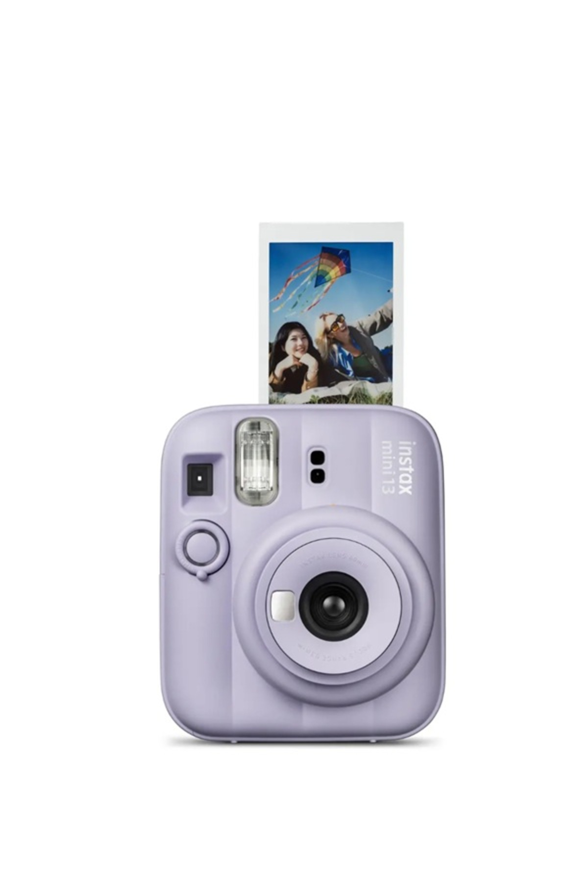 Uçurtma altında gülen iki kadını gösteren çıkan bir fotoğrafla birlikte mor anlık kamera.