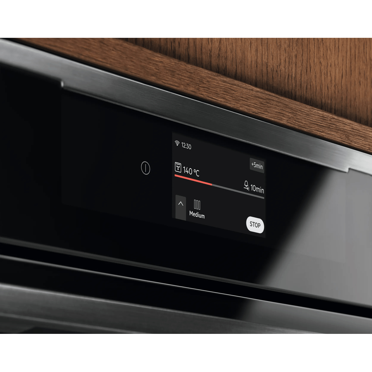 Forno in acciaio inossidabile con display digitale che mostra 140 gradi Celsius e un timer di 10 minuti.