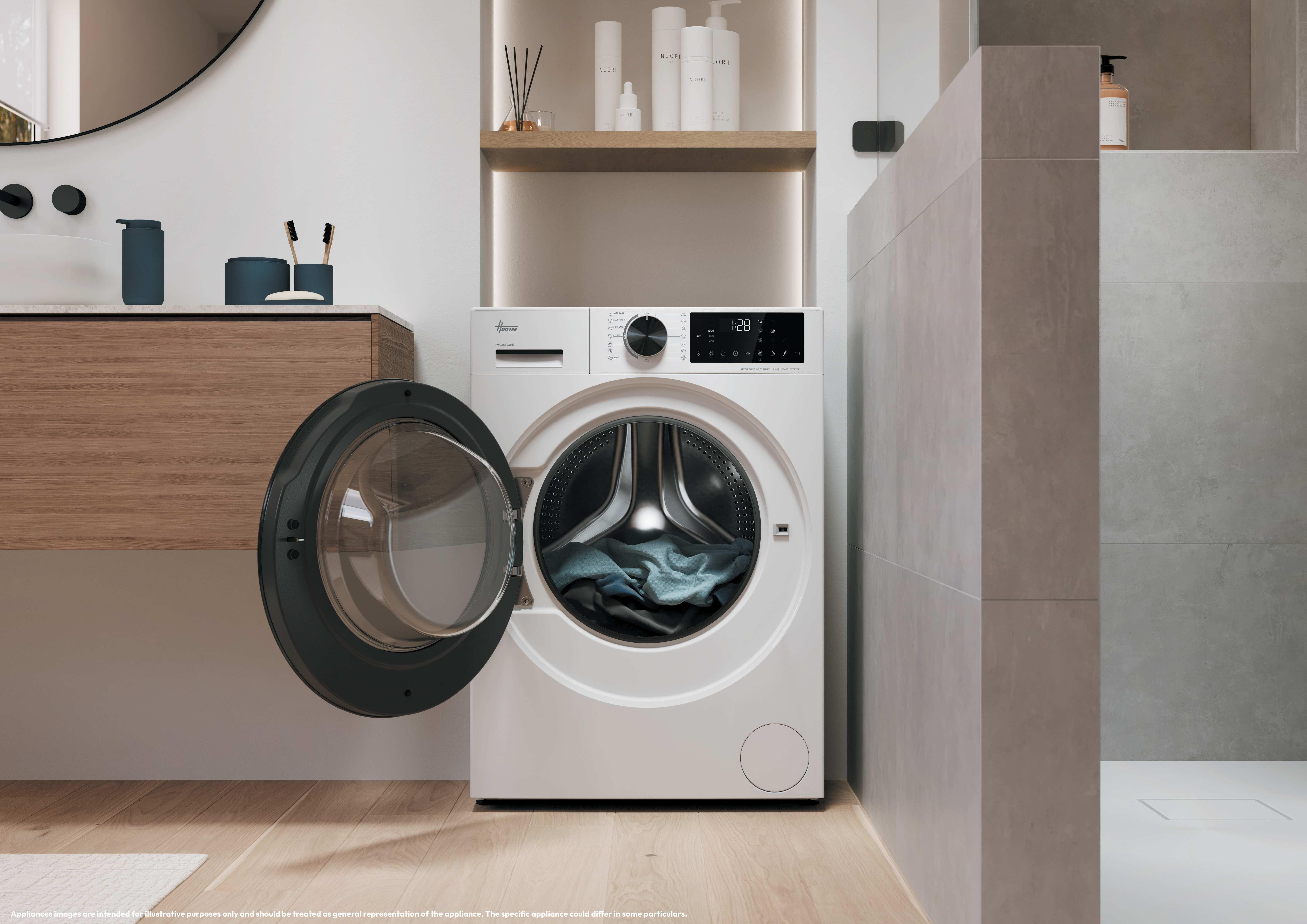 Una lavatrice bianca con la porta aperta si trova in un bagno moderno vicino a un mobile in legno e a una doccia.