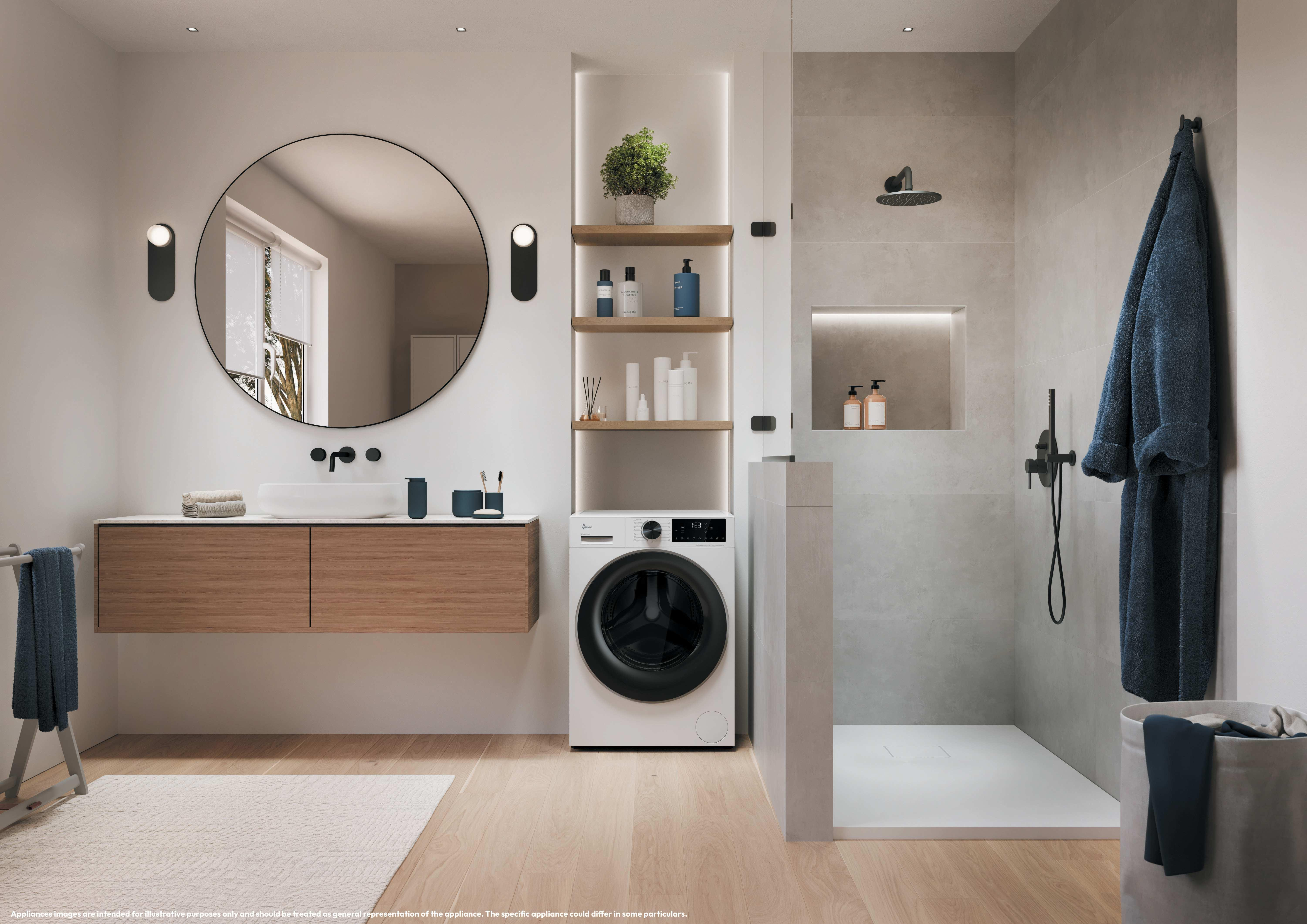 Bagno moderno con mobile in legno, specchio tondo, lavatrice e doccia con piastrelle grigie.
