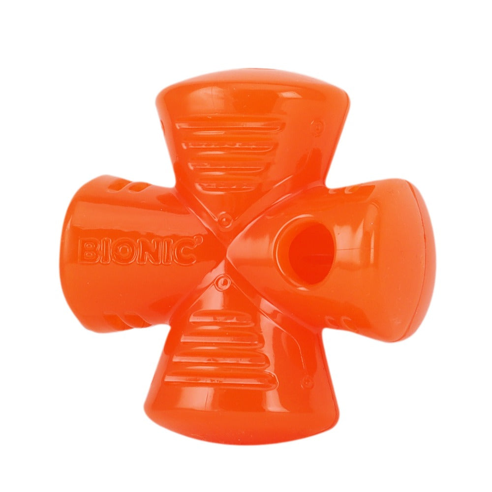 Un juguete para perros naranja en forma de cruz con la marca Bionic en el brazo izquierdo, sobre fondo blanco.