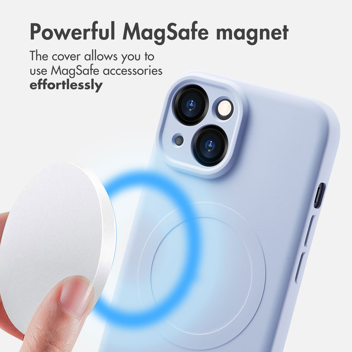 A light blue smartphone with a MagSafe case and a round magnet in the foreground.