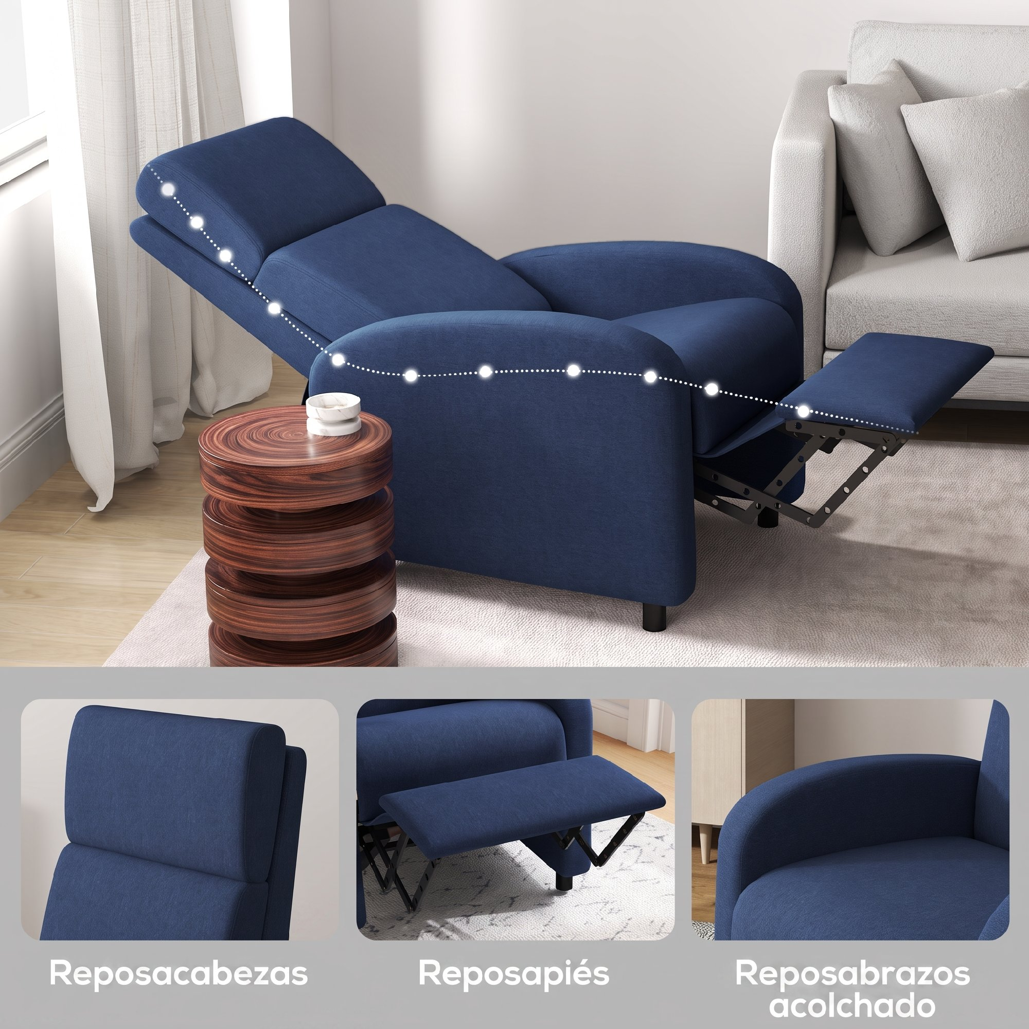 Un sillón reclinable azul con reposapiés extendido, junto a una mesa de madera y un sofá blanco.