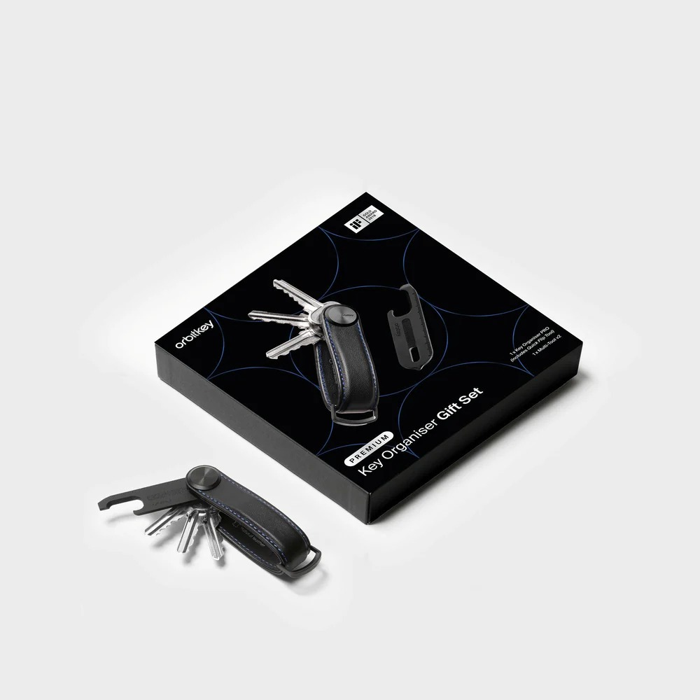 Zestaw prezentowy Orbitkey Key Organiser w czarnym opakowaniu ze złożonym organizerem z przodu.