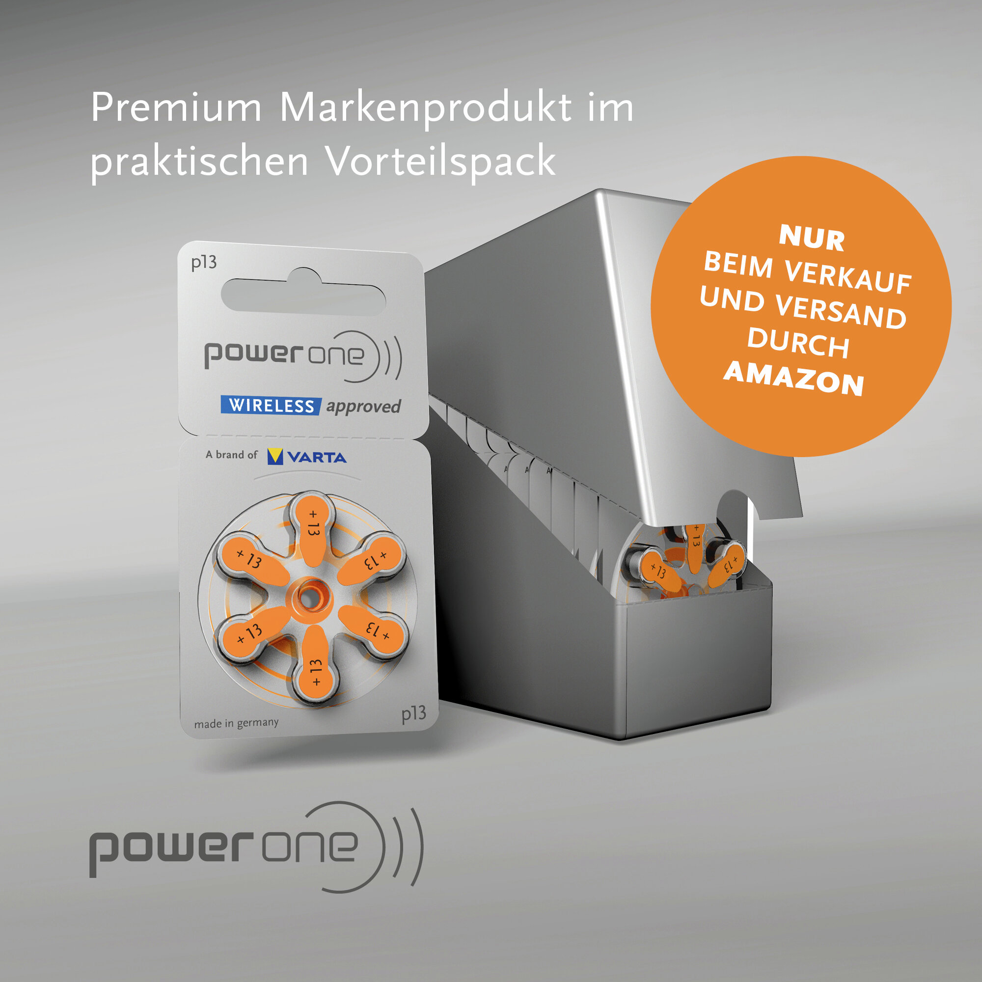 Power One Hörgerätebatterien in Verpackung vor einem silbernen Spender mit orangem Werbekkreis.