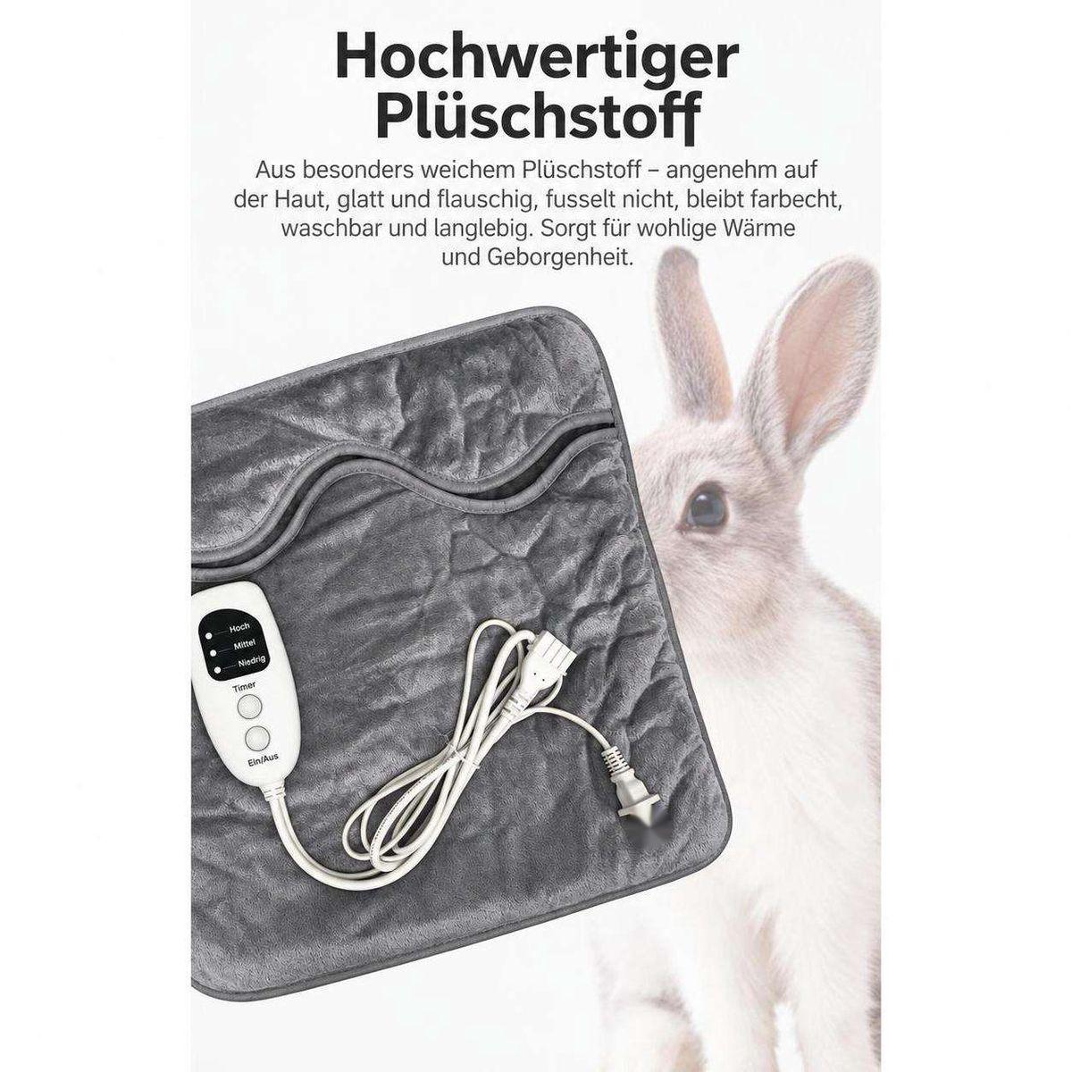 Graue Plüsch-Heizdecke mit Bedienelement und Kabel, daneben ein sitzender Hase.