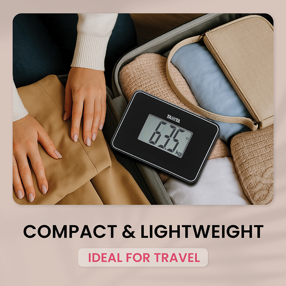 A suitcase with a small black Tanita scale and clothes being packed by hands.