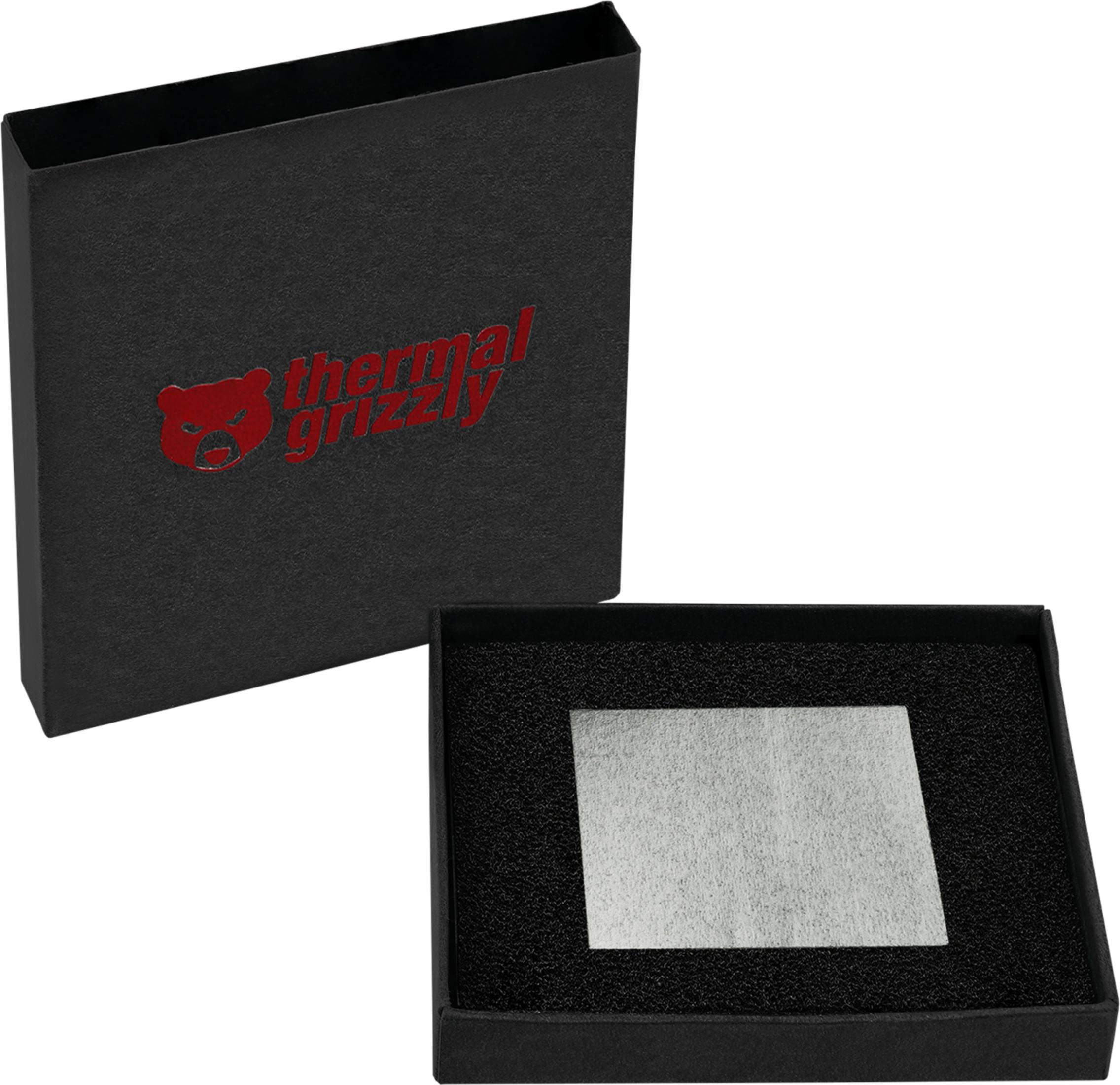 Una caja negra abierta con logo rojo de Thermal Grizzly y una almohadilla gris en espuma.