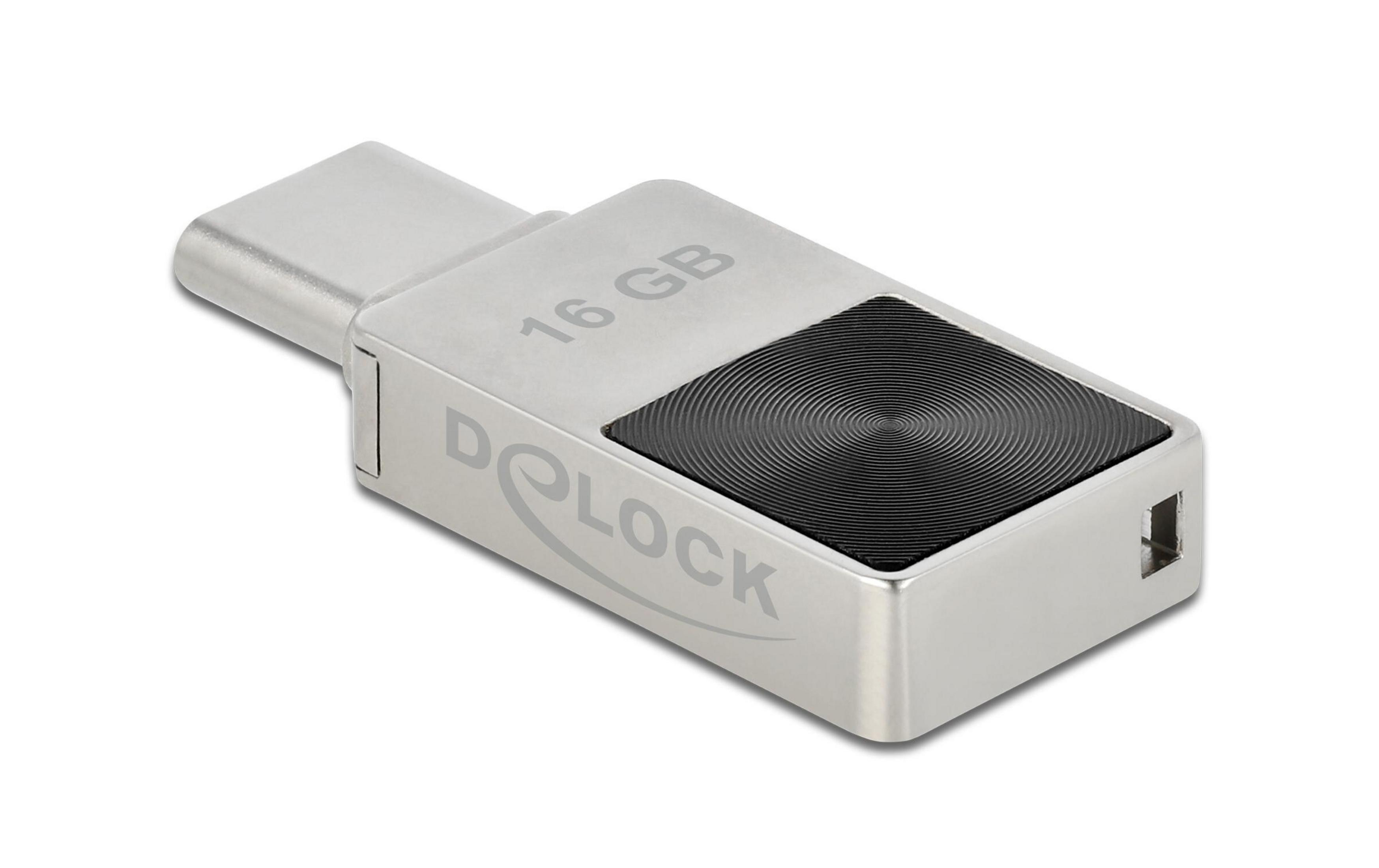 Una memoria USB Delock plateada de 16 GB con conector USB-C y patrón circular negro en la parte superior.