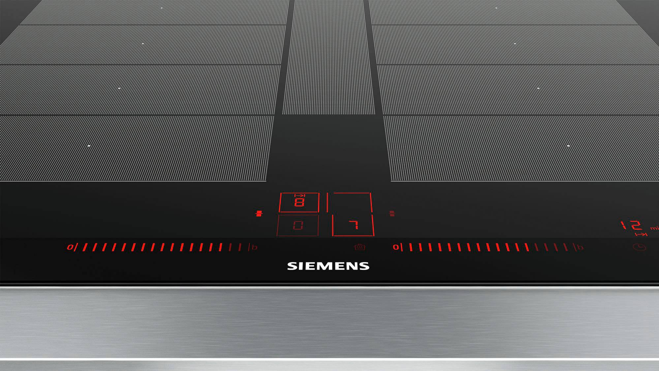 Primer plano de una placa de inducción Siemens con pantalla LED roja y controles táctiles en vidrio negro.
