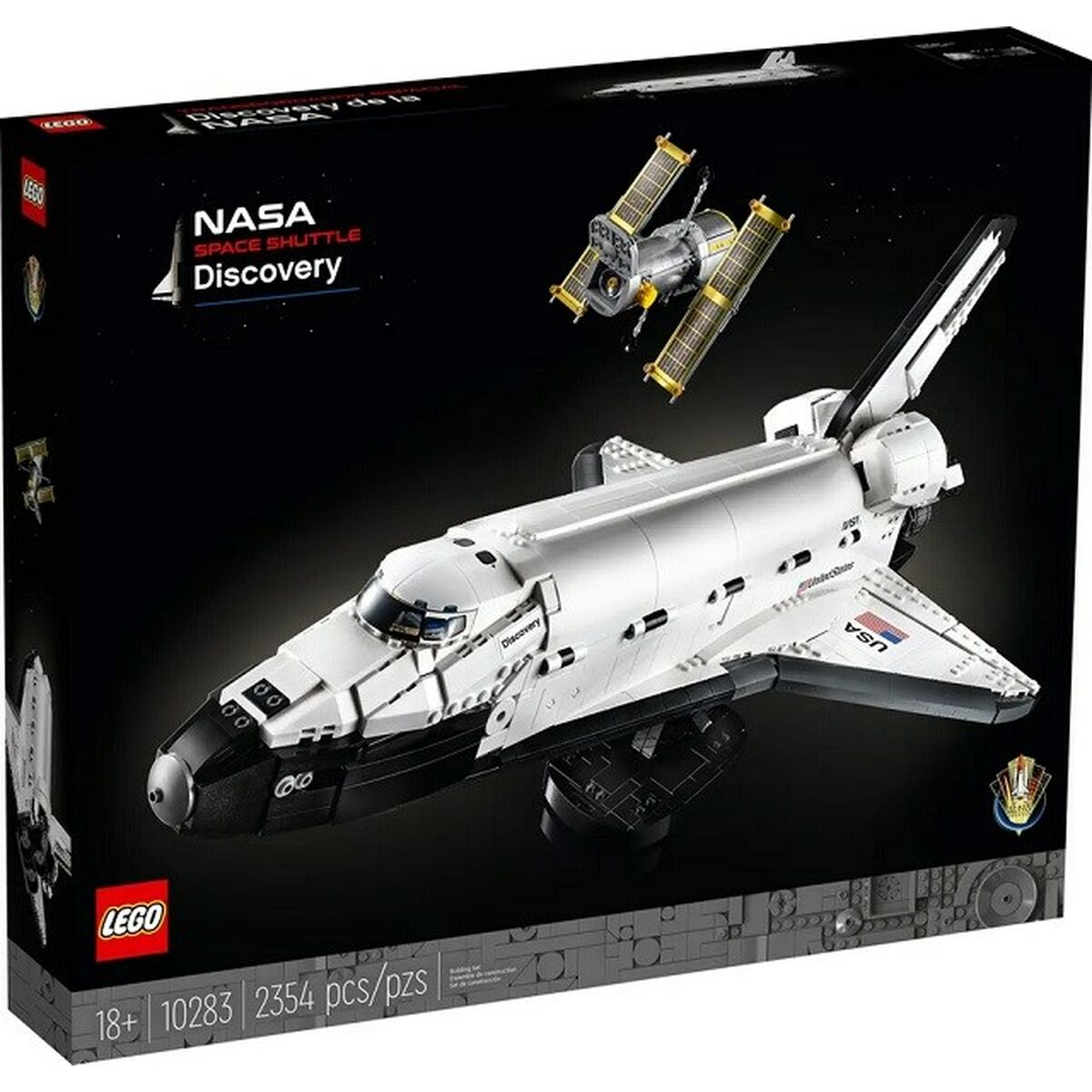 Boîte LEGO NASA Space Shuttle Discovery montrant la navette blanche et le télescope Hubble.