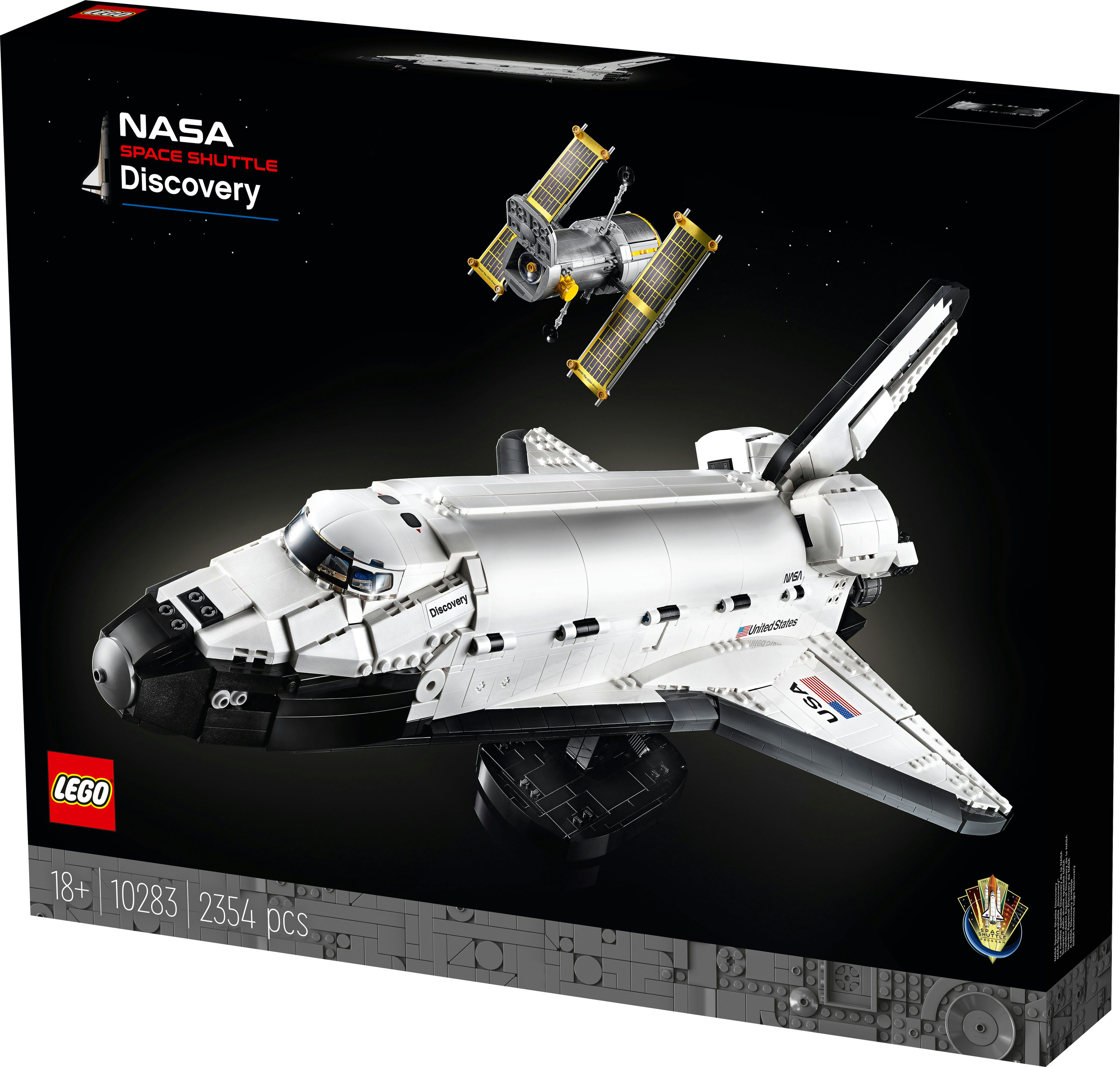 Boîte Lego montrant la navette spatiale Discovery de la NASA et le télescope Hubble sur fond d'espace noir.