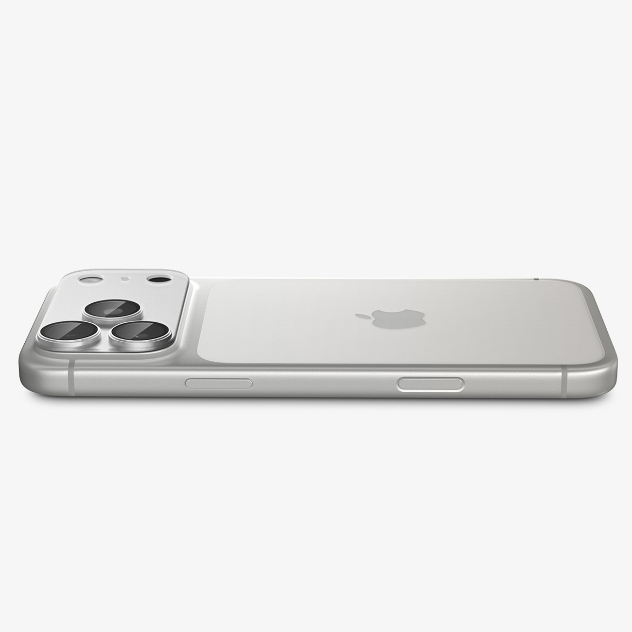 Srebrny smartfon leży płasko, pokazując potrójny aparat i logo Apple.