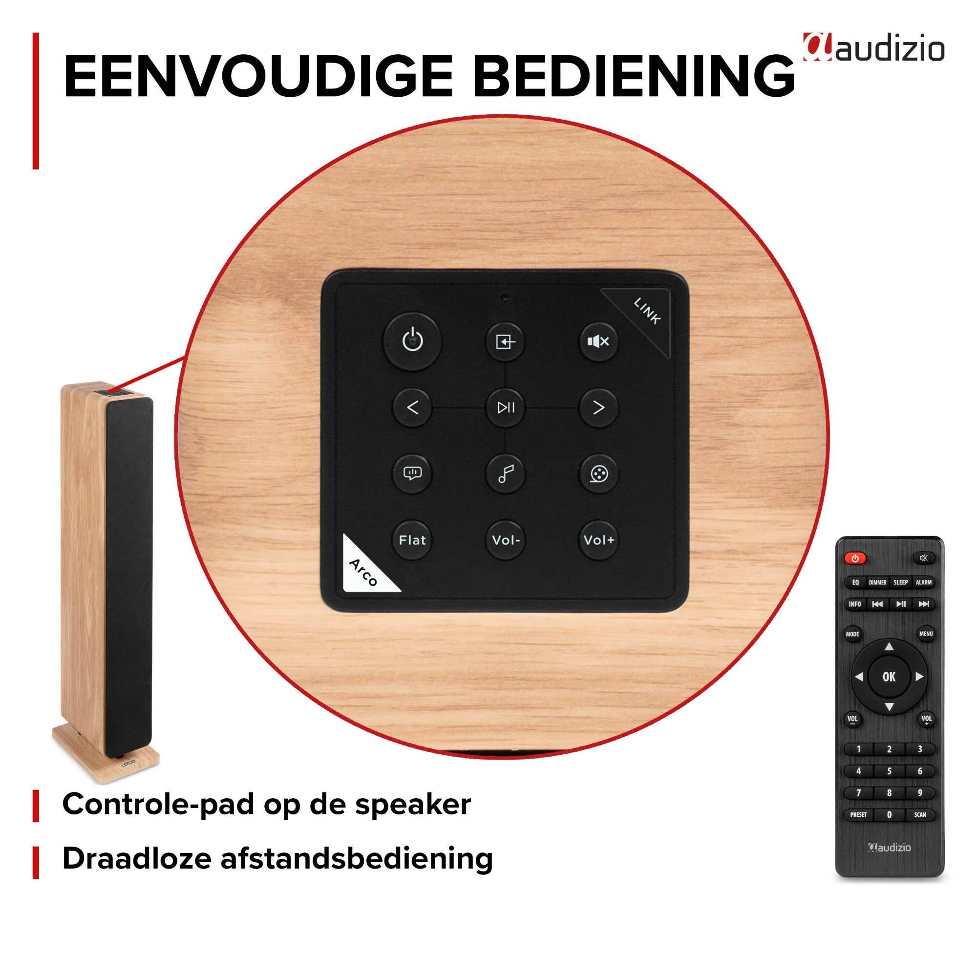 Altavoz de madera con panel de control negro y mando a distancia arriba.