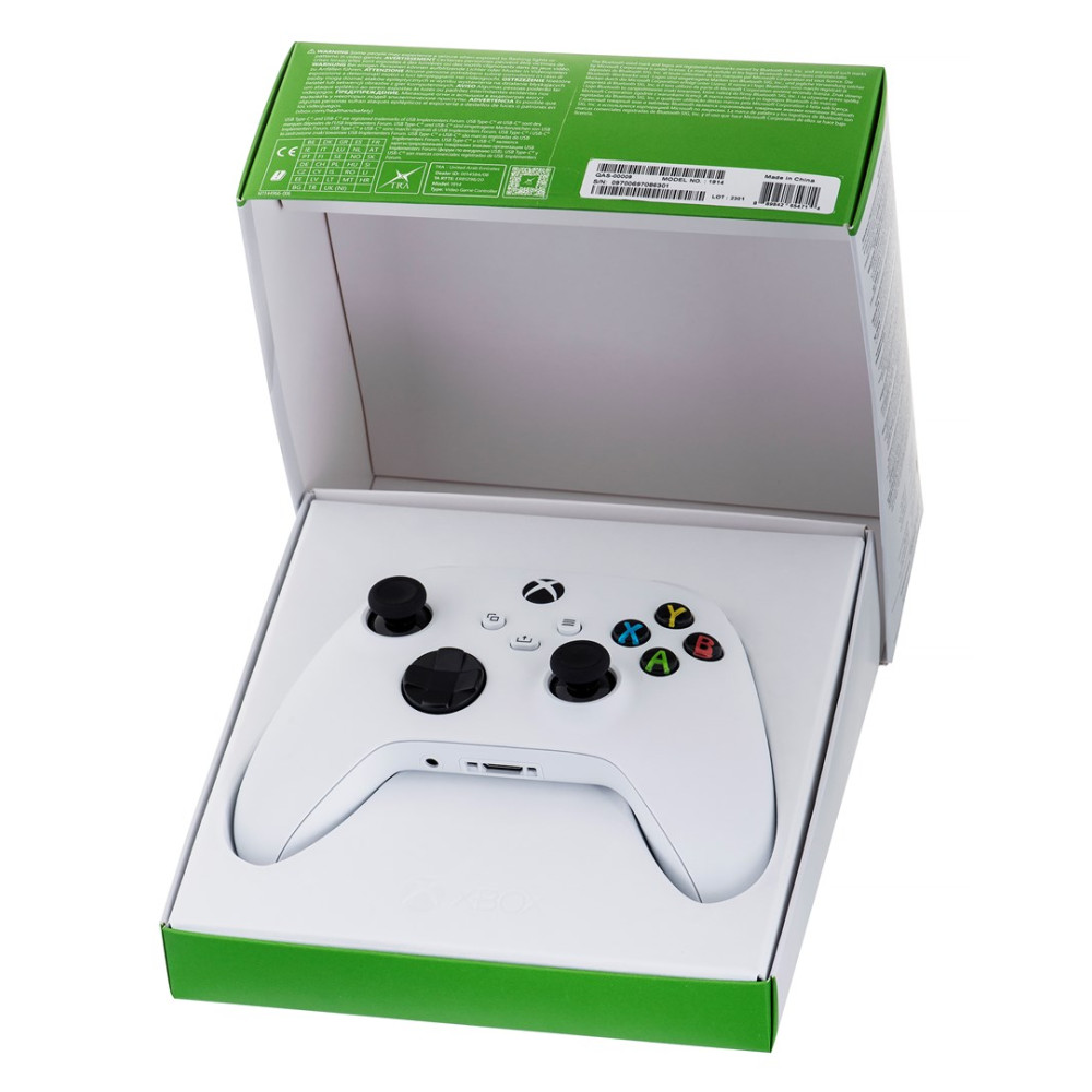 Ein weißer Xbox-Wireless-Controller in der geöffneten weiß-grünen Verpackung.