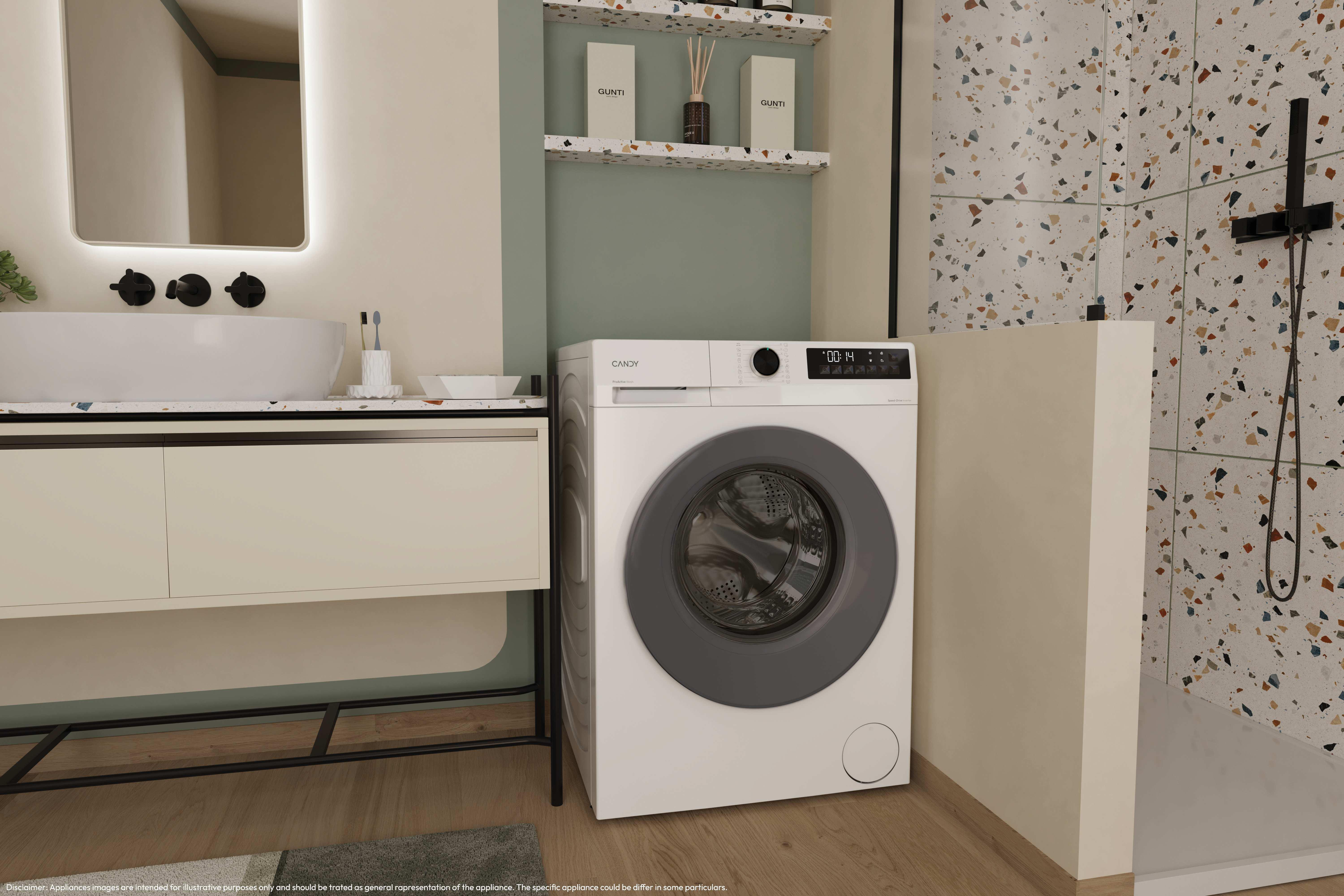 Lavatrice moderna in bagno verde chiaro accanto a mobile lavabo e doccia con piastrelle in terrazzo.
