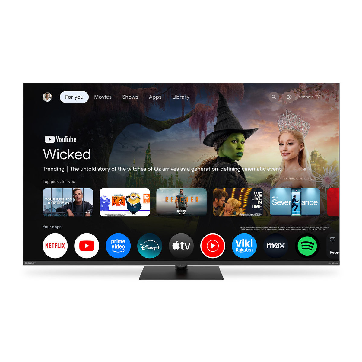 Uno schermo smart TV mostra l'interfaccia Google TV con un banner promozionale di Wicked.